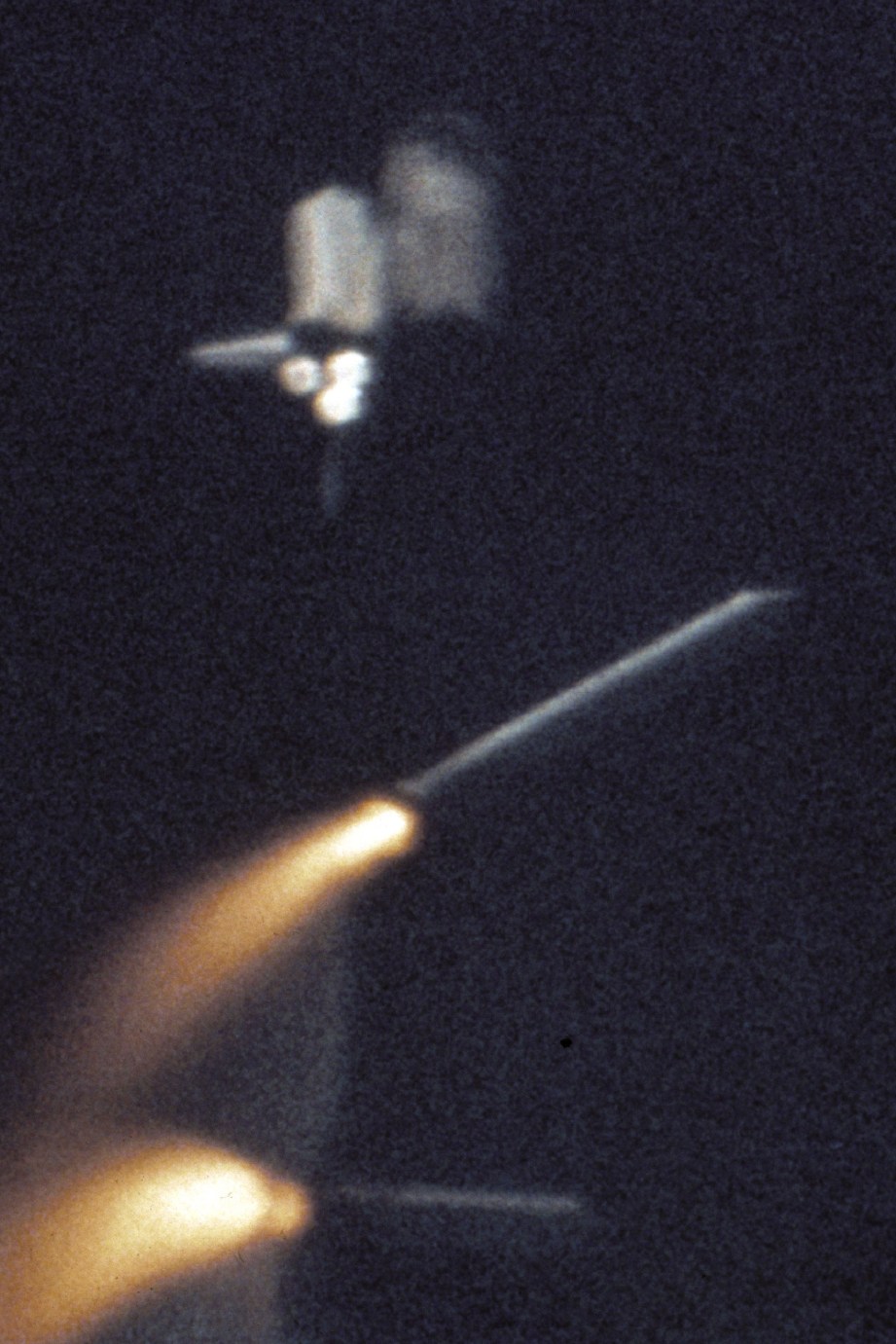 The Shuttle's Solid Rocket Boosters break away and fall to Earth about two minutes after liftoff.