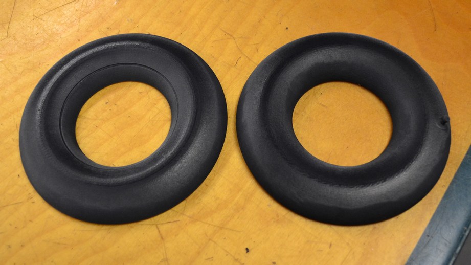 Two halves of an inner tube model about the size of a bagel. By mixing rubber and black plastic the end result feels like a real inner tube.