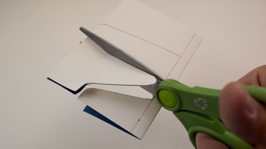 Be careful to avoid creasing the airplane as you cut out the profile with scissors.