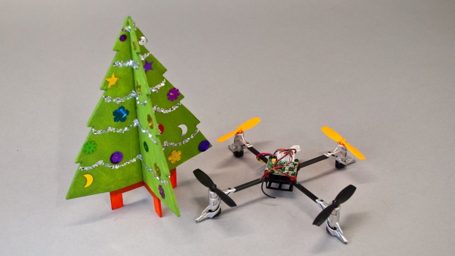 The completed decoration is easily swappable on the quad. Have everyone make their own version to fly around!